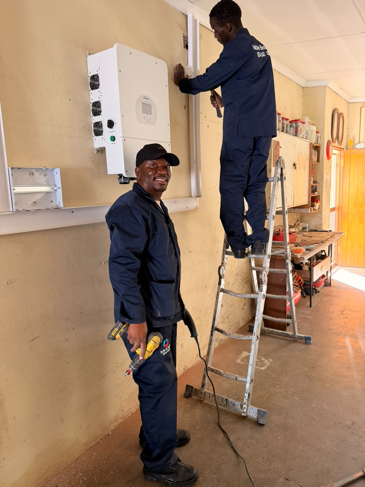 McDen electrician inspecting industrial switchgear
